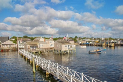 photo of beach town on supports over water
