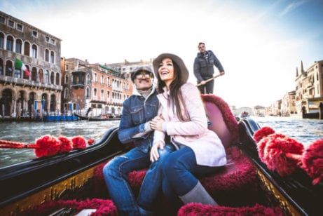 Couple in river boat in Europe
